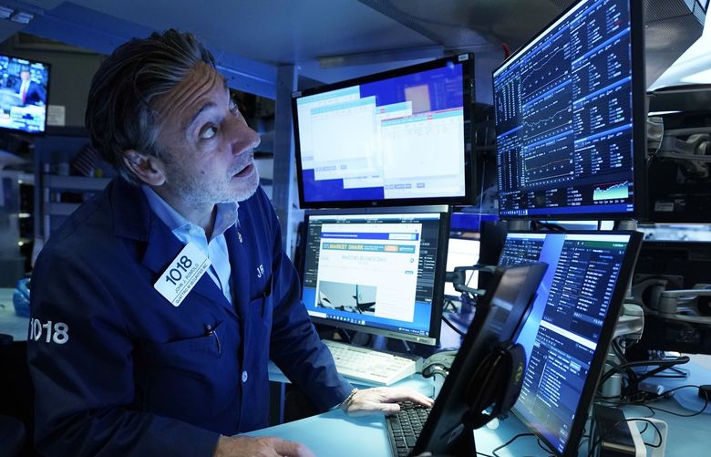 Trader John Romolo works on the floor of the New York Stock Exchange, Monday, July 12, 2021.  (AP Photo/Richard Drew) NYRD105 NYRD105