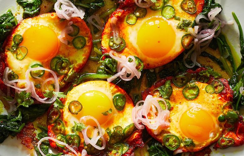 Turmeric fried eggs with tamarind and pickled shallots in New York on June 15, 2021. If you have something fresh, something flavorful and something in need of using up, you’re most of the way to a meal, Yotam Ottolenghi writes. XNYT37