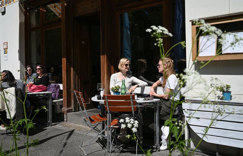 FILE – A cafe with sidewalk tables in Berlin, May 21, 2021. Although the infection rate in Germany remains low, the number of new cases has doubled in the last week.  (Lena Mucha/The New York Times)