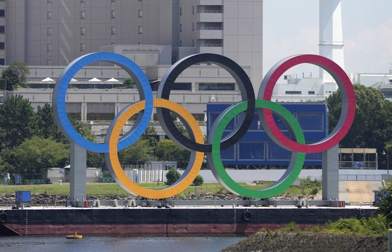 The Olympic rings float on a barge ahead of the 2020 Summer Olympics, Monday, July 19, 2021, in Tokyo. (AP Photo/Charlie Riedel) OLYCR134 OLYCR134