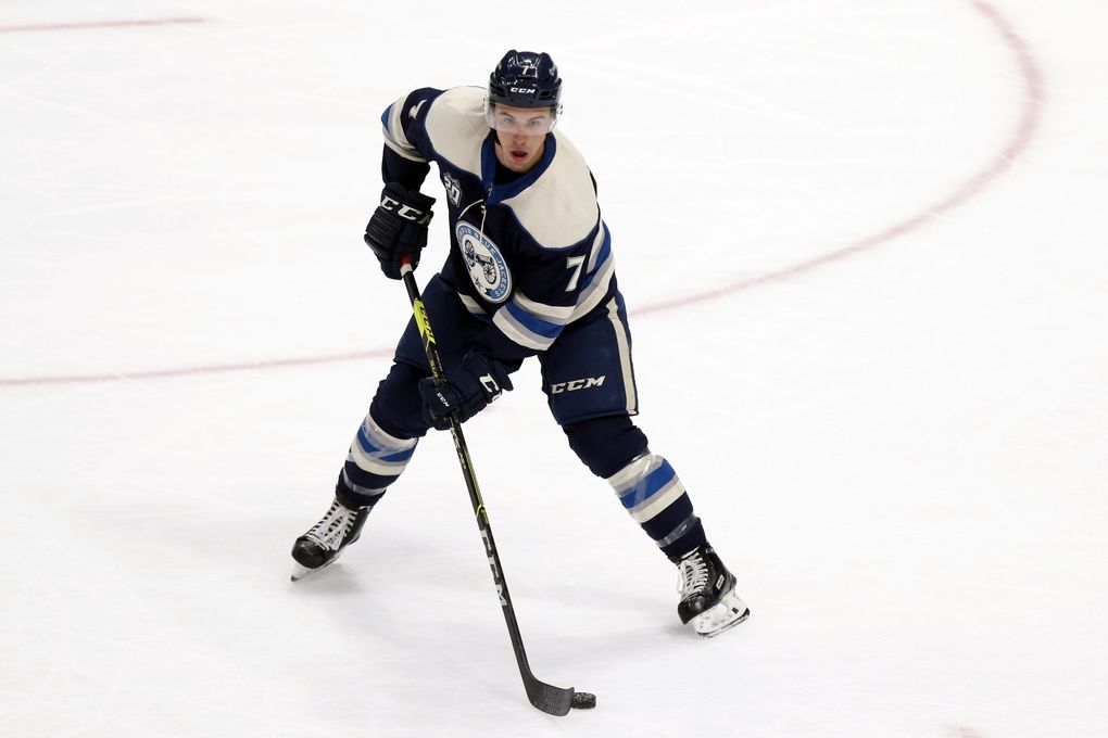 Columbus Blue Jackets defenseman Gavin Bayreuther controls the puck during an NHL hockey game against the Detroit Red Wings in Columbus, Ohio, Friday, May 7, 2021. The Red Wings won 5-2. (Paul Vernon / AP)