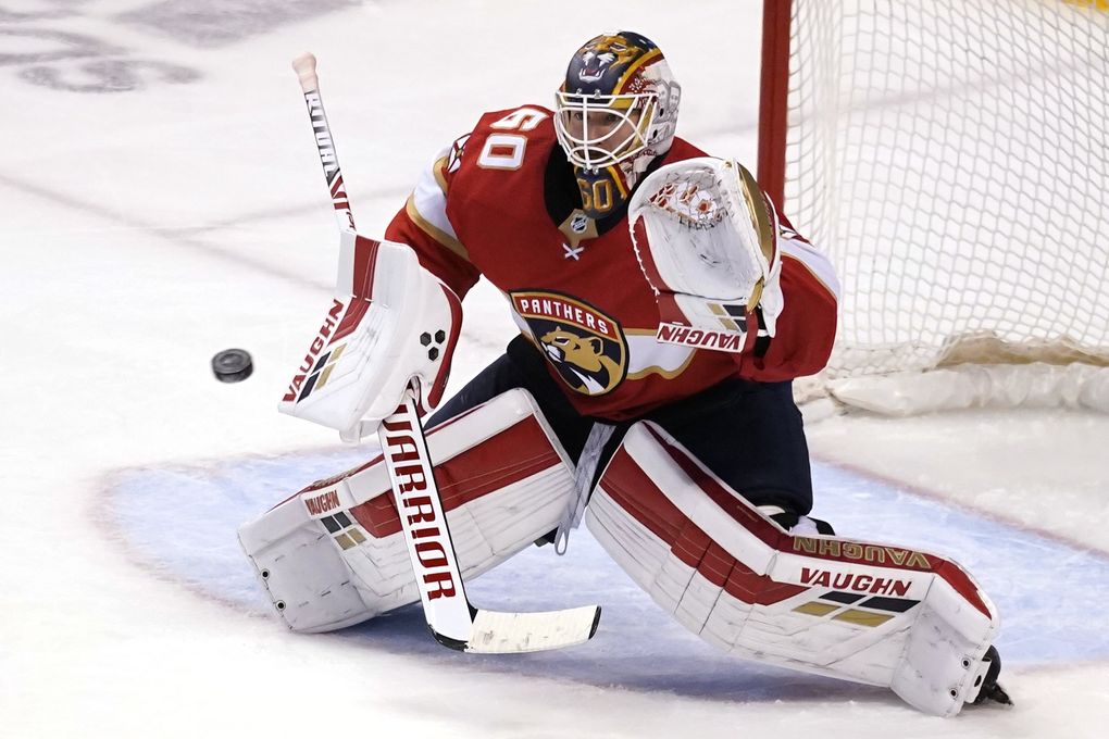 Florida Panthers goaltender Chris Driedger (60) defends the goal during the third period in Game 2 of an NHL hockey Stanley Cup first-round playoff series against the Tampa Bay Lightning, Tuesday, May 18, 2021, in Sunrise, Fla. (Lynne Sladky / AP)