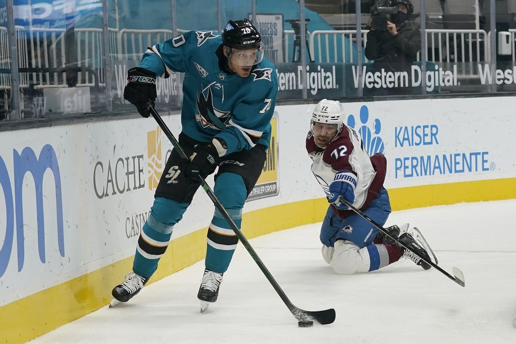 San Jose Sharks center Alexander True, left, skates against Colorado Avalanche right wing Joonas Donskoi (72) during a game in San Jose, Calif., in March. (Jeff Chiu / AP)