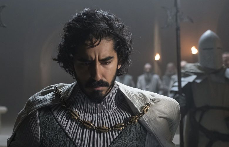 This image released by A24 shows Dev Patel in a scene from “The Green Knight.” (Eric Zachanowich/A24 Films via AP) NYET673 NYET673