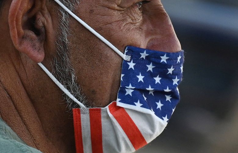 A man wears a U.S. flag face mask on July 19, 2021, on a street in Hollywood. (Robyn Beck/AFP/Getty Images/TNS) 22804259W 22804259W