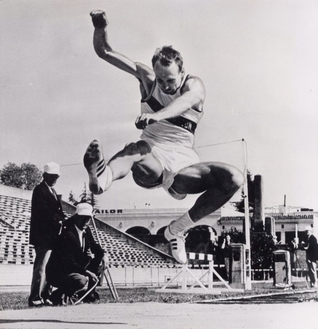 Phil Shinnick jumps during a meet for UW. (AP)