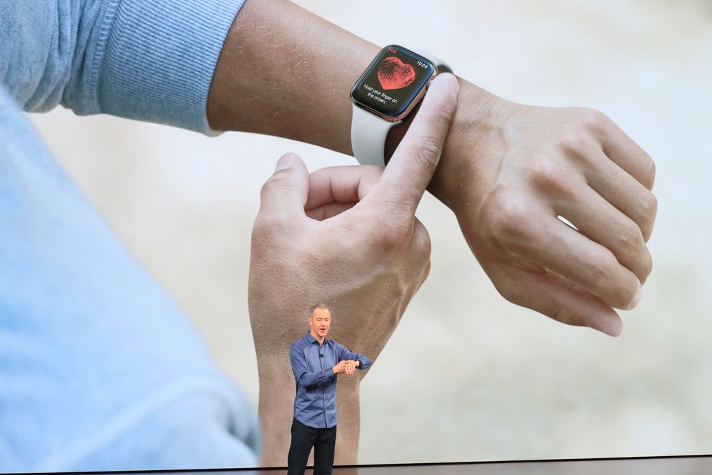 FILE — Jeff Williams, chief operating officer of Apple, talks about the electrocardiogram features on the Apple Watch Series 4, at the Steve Jobs Theater in Cupertino, Calif., Sept. 12, 2018. One in five Americans uses a Fitbit, Apple Watch or other wearable fitness tracker. And over the past year, several studies have suggested that the devices — which can continually collect data on heart rates, body temperature, physical activity and more — could help detect early signs of COVID-19 symptoms. (Jim Wilson/The New York Times)
