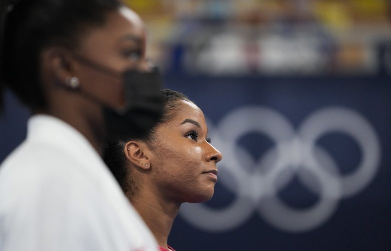 Simone Biles, left, of the United States, stands with to teammate Jordan Chiles after to the latter’s performance on the uneven bars during the artistic gymnastics women’s final at the 2020 Summer Olympics, Tuesday, July 27, 2021, in Tokyo. (AP Photo/Ashley Landis) OLYAL102 OLYAL102