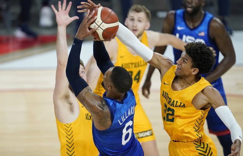 Australia’s Matisse Thybulle knocks the ball away from United States’ Damian Lillard during an exhibition basketball game Monday, July 12, 2021, in Las Vegas. (AP Photo/John Locher) NVJL109 NVJL109