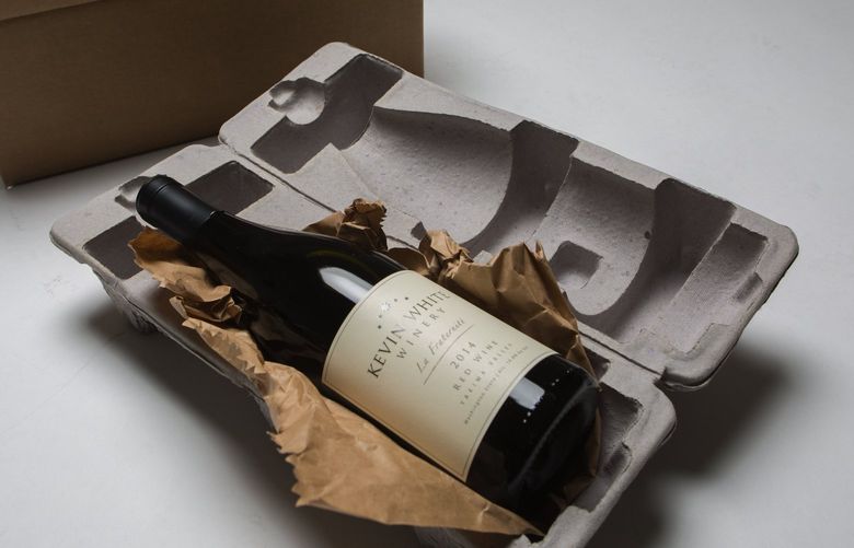 A bottle of wine and the packing material used for shipping wine around the country is photographed in the Seattle Times studio Friday, December 30, 2016.