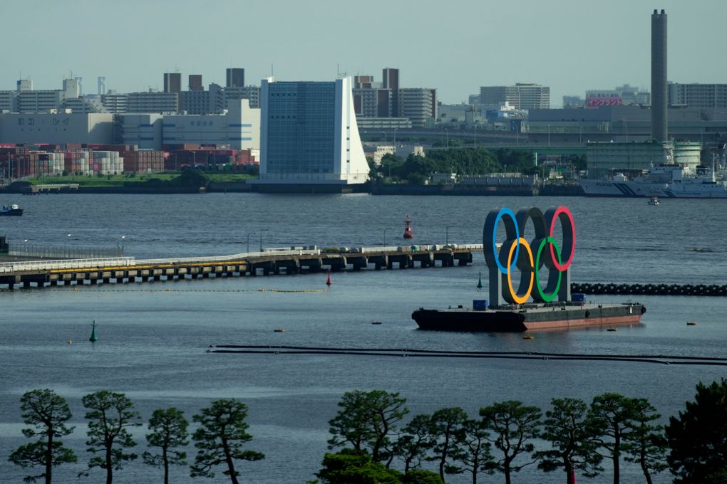 The Olympic Rings float on a barge at Odaiba Marine Park as Tokyo prepares for the 2020 Summer Olympics, Friday, July 16, 2021. The pandemic-delayed games open on July 23 without spectators at most venues. (AP Photo/Charlie Riedel)