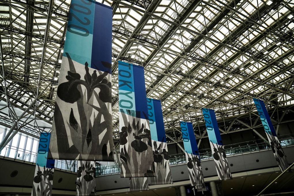 Tokyo 2020 banners adorn the main press center of the 2020 Summer Olympics, Monday, July 12, 2021, in Tokyo. (AP Photo/Jae C. Hong)