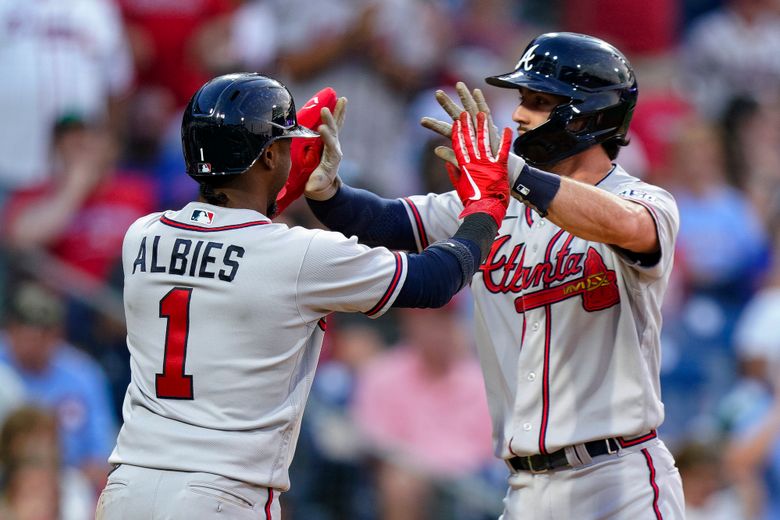 Orlando Arcia and Ozzie Albies of the Atlanta Braves celebrate