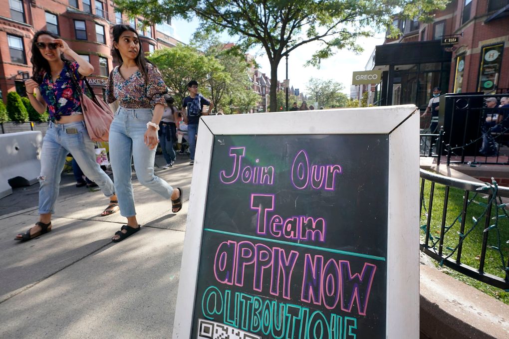A sign for a shop in Boston advertises job openings Monday. As the U.S. economy bounds back with unexpected speed from the pandemic recession and customer demand intensifies, teenagers are filling jobs that older workers can’t — or won’t. (Steven Senne / The Associated Press)