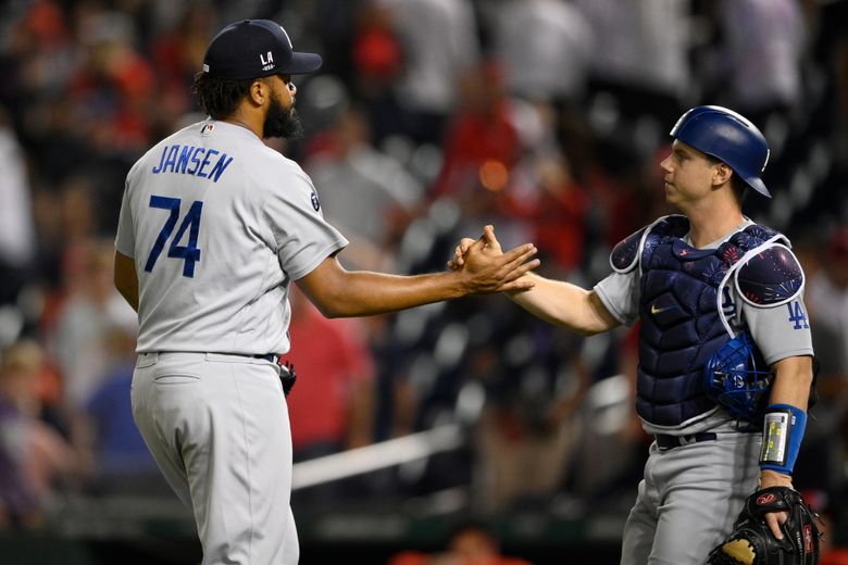 Los Angeles Dodgers catcher Will Smith throws to second base during a