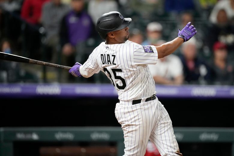 Elias Diaz of the Colorado Rockies celebrates with Brendan Rodgers