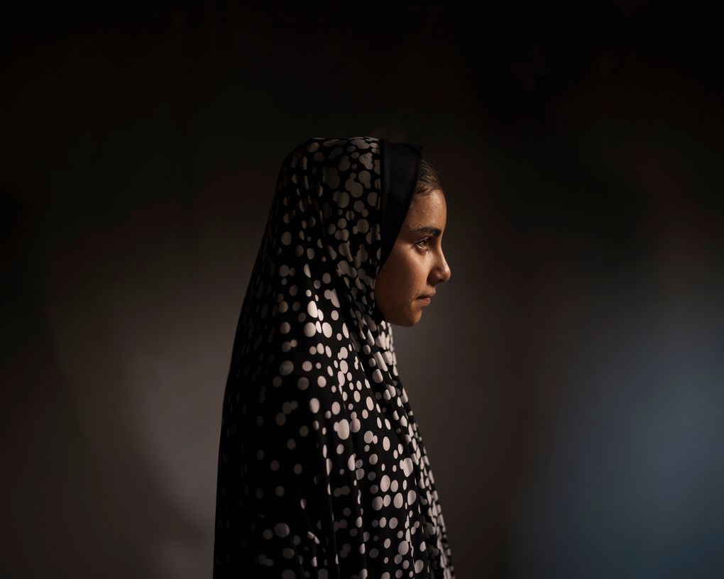 Batool al-Masri, 14, poses for a portrait at her house in Beit Hanoun, northern Gaza Strip, Sunday, June 20, 2021. In a field near their home on May 10, Batool carried her cousin Yazan, a toddler barely 2 years old. “Twenty-four hours a day she was spoiling him,” says Batool’s father, Mohammed Atallah al-Masri. Then, an explosion. It’s not clear whether the rocket was fired by Israel or Hamas. But in an instant, eight people were dead, including six children. Yazan bled out in front of Batool. She tried to save him, ignoring injuries to her legs and pelvis. (AP Photo/Felipe Dana)