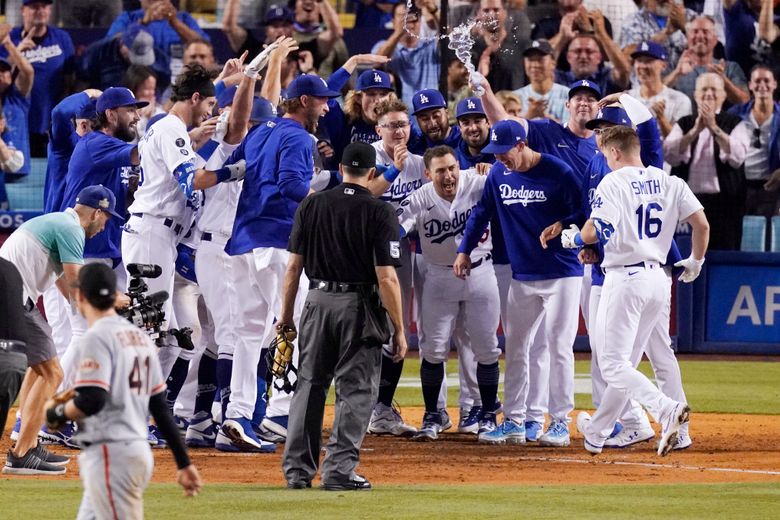 Los Angeles Dodgers' Will Smith plays during the third inning of a