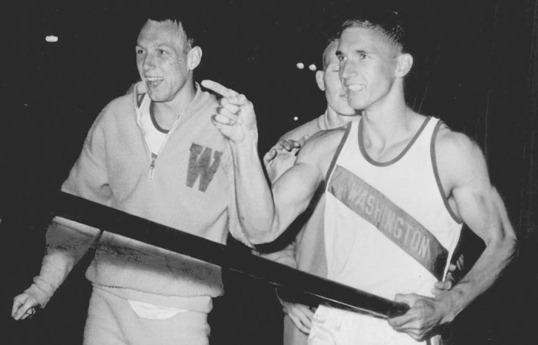 Record-Smashers: In Modesto, Calif. Sternberg, right, smiled after officials measure 1is world-record pole vault at 16 feet 7 inches Saturday night. Congratulating him was Phil Shinnick, his University of Washington teammate, hose 27-4 broad jump which bettered the world record was disallowed because the wind gauge was not manned.