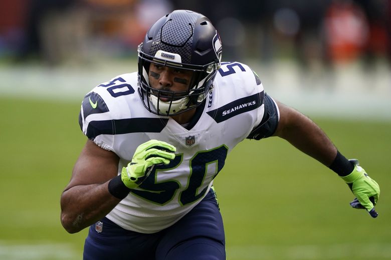 Seattle Seahawks linebacker K.J. Wright walks on the field Tuesday