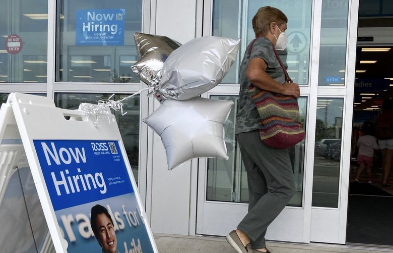 A shopper passes a hiring sign while entering a retail store in Morton Grove, Ill., Wednesday, July 21, 2021. Despite an uptick in COVID-19 cases and a shortage of available workers, the U.S. economy likely enjoyed a burst of job growth last month as it bounces back with surprising vigor from last yearâ€™s coronavirus shutdown. The Labor Departmentâ€™s July jobs report Friday, Aug. 6 is expected to show that the United States added more than 860,000 jobs in July, topping Juneâ€™s 850,000, according to a survey of economists by the data firm FactSet.   (AP Photo/Nam Y. Huh) NYBZ801 NYBZ801