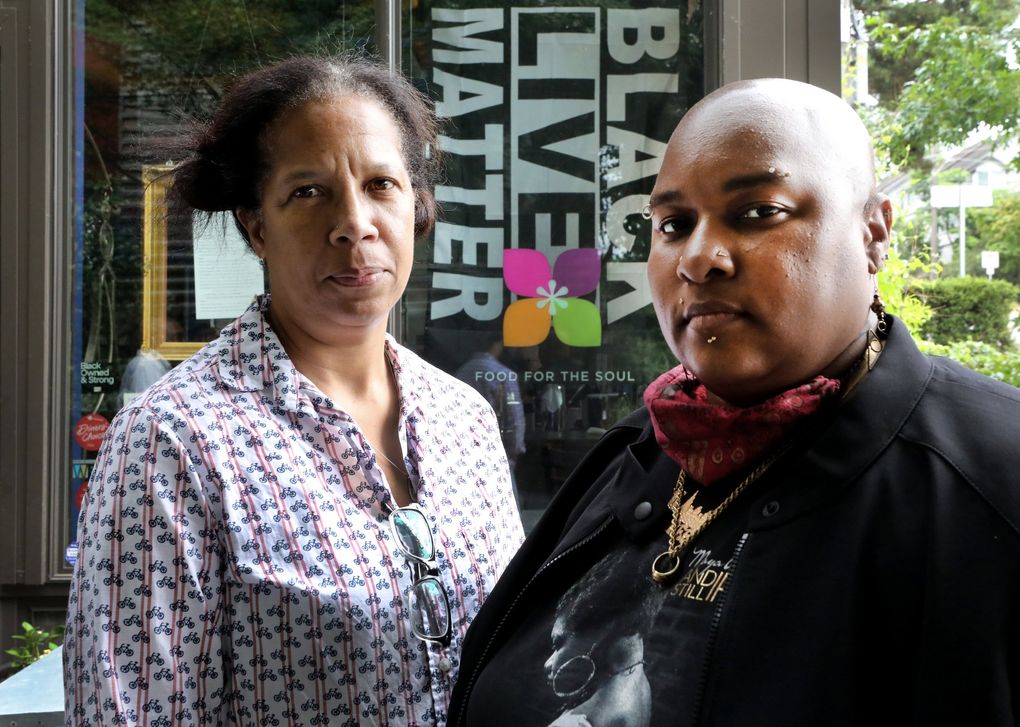 Donna Moodie, left, and Sharon Nyree Williams served on Seattle’s Equitable Communities Initiative, recommending $30 million for programs aimed at communities of color. The City Council approved the investments Monday. (Alan Berner / The Seattle Times)