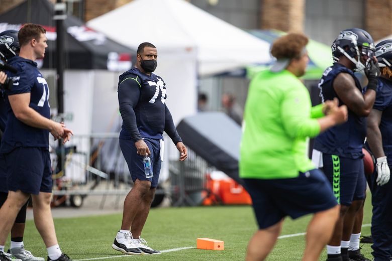 Seahawks end day before training camp with flurry of roster moves and  restructured contract