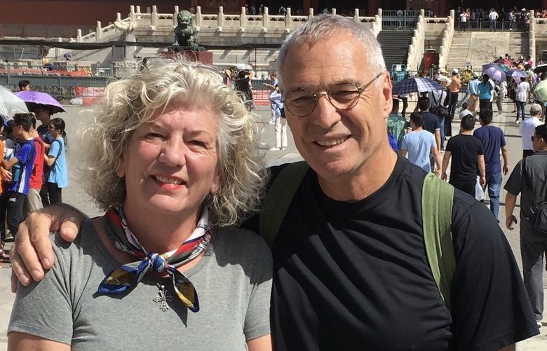 Debbie and Michael Campbell take a walking tour in Tiananman Square in Beijing, China.