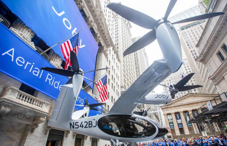 A Joby Aviation Inc. Electric Vertical Take-Off and Landing (eVTOL) aircraft outside the New York Stock Exchange (NYSE) during the company’s initial public offering in New York, U.S., on Wednesday, Aug. 11, 2021. JobyÂ Aviation, which promises to build and operate a commercial fleet of aerial taxis by 2024, began trading Wednesday, testing the imaginations of public investors. The shares surged more than 12% during the first hour of trading. Photographer: Michael Nagle/Bloomberg 775695046