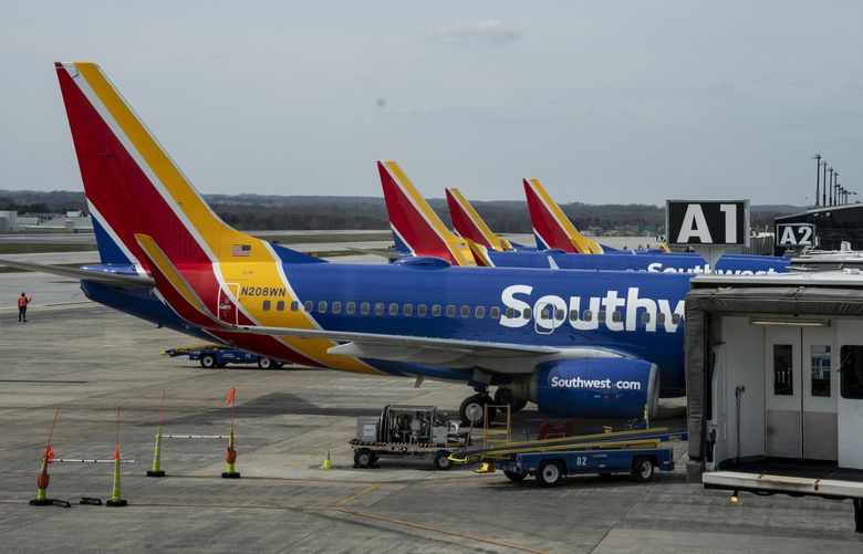 FILE — Southwest Airlines planes at Baltimore/Washington International Thurgood Marshal Airport in Baltimore, March 22, 2020. In a securities filing on Wednesday, Aug. 11, 2021, the company forecast revenue for the three months that end in September to be down 15 to 20 percent compared with the same period in 2019, a decline of three to four percentage points from its previous estimate. (Anna Moneymaker/The New York Times) XNYT24 XNYT24