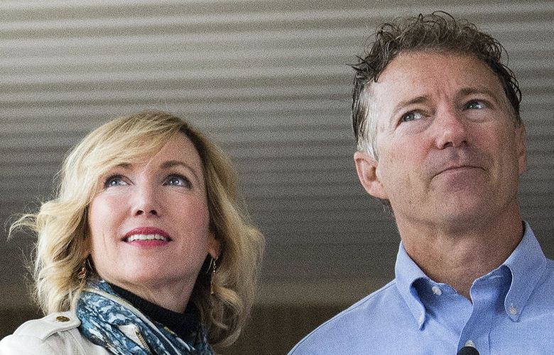 FILE – In this Nov. 8, 2016, file photo Sen. Rand Paul, R-Ky., and his wife Kelley Paul, speak with members of the media after casting their votes at Briarwood Elementary School in Bowling Green, Ky. Rand Paul waited more than a year to disclosure that his wife purchased stock in a company that makes a COVID-19 treatment, an investment made after Congress was briefed on the threat of the virus but before the public was largely aware of its danger. (AP Photo/Michael Noble Jr., File) WX103