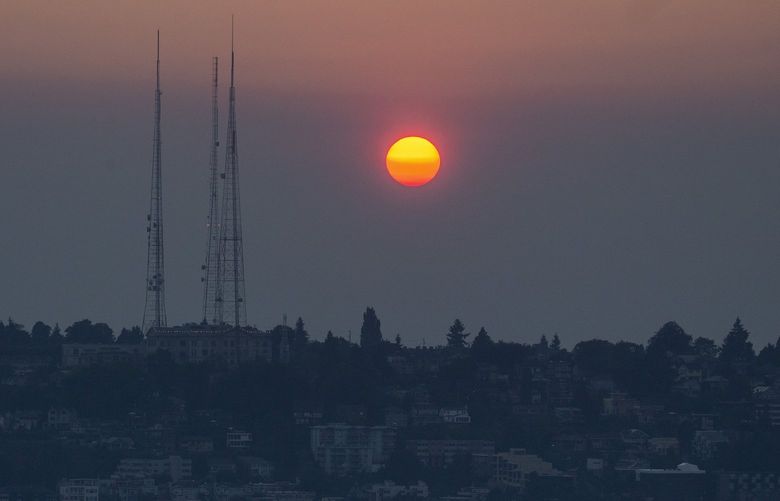 A smoky sunset over Queen Anne neighborhood on Thursday, August 12, 2021.