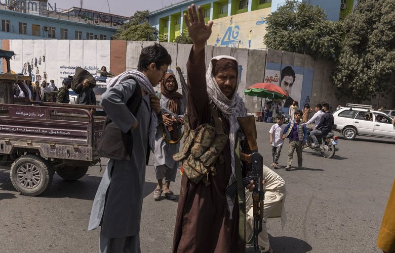 Taliban gunmen confront protesters in Kabul, Afghanistan, on Thursday, Aug. 19, 2021. A sluggish State Department response to the Taliban’s rapid takeover of Kabul, Afghanistan’s capital, has stranded thousands of Afghans who helped the United States and are now clamoring to be evacuated as they wait for their immigration visas to be approved, two U.S. officials said. (Victor J. Blue/The New York Times) XNYT222 XNYT222