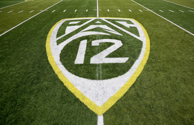 ADVANCE FOR SATURDAY, OCT. 1 – In this Oct. 10, 2015, file photo,  a PAC-12 logo is seen painted on the field before an NCAA college football game between Washington State and Oregon in Eugene, Ore. Larry Scott helped transform and modernize the Pac-12 when he took over as commissioner, helped the conference land a $3 billion TV deal and create its own network. Eight years later, the conference is reaping financial rewards and he believes it is well-positioned to adapt to the changing landscape of both college sports and media rights. (AP Photo/Ryan Kang, File) NY184