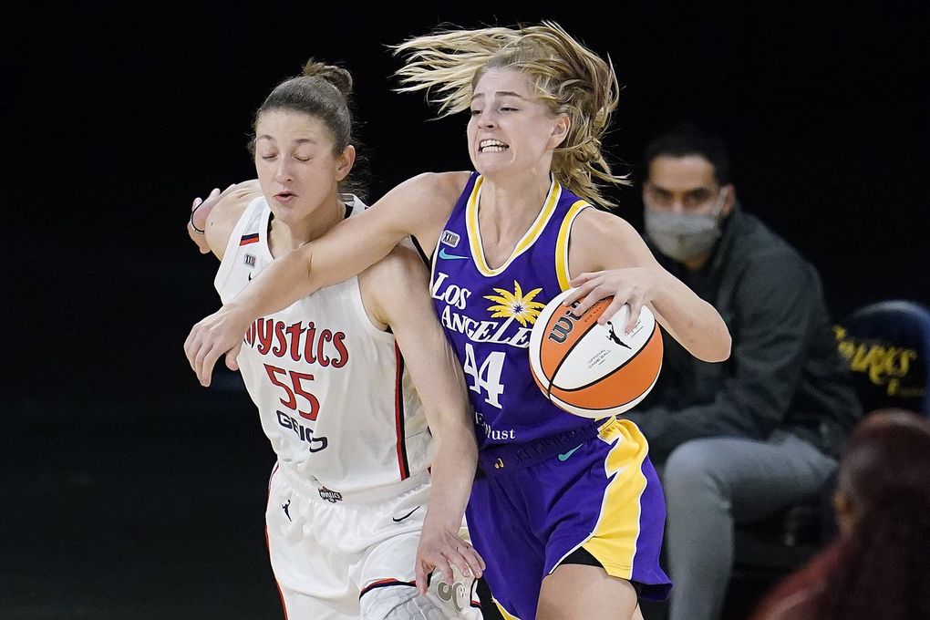 Los Angeles Sparks forward Karlie Samuelson, right, is defended by Washington Mystics forward Theresa Plaisance during a game, June 24, 2021, in Los Angeles. (Marcio Jose Sanchez / AP)