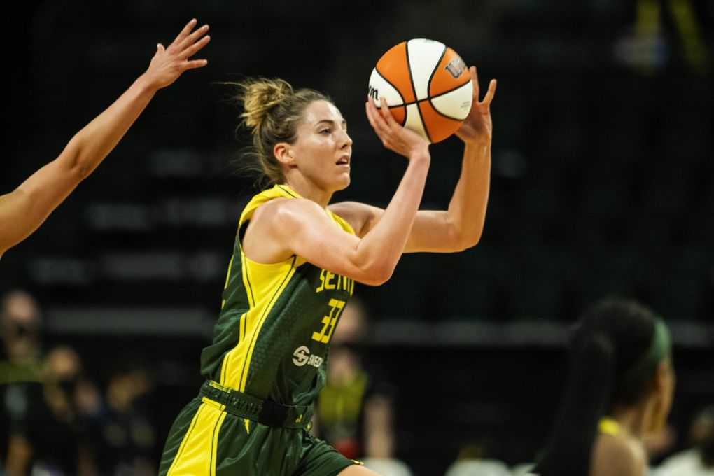Katie Lou Samuelson hits a shot with no time left, and from near midcourt, to end the third quarter against Las Vegas, May 18, 2021, in Everett. (Dean Rutz / The Seattle Times)