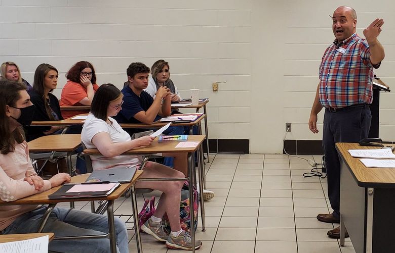 Instructor Brandon Smith discusses using online tools with students in an intermediate college algebra class at Wallace State Community College’s Hanceville campus on the first day of classes for the fall semester on Aug. 19, 2021. The class combines students who are also in a companion one-hour course that provides additional help with the college-level course and their peers who are not enrolled in the co-requisite class.