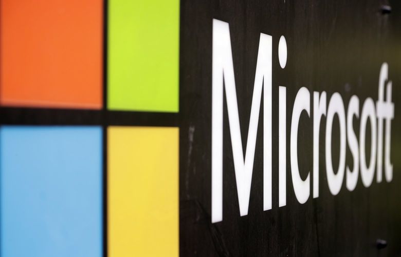 FILE – In this Wednesday, Feb. 3, 2021 file photo, the Microsoft company logo is displayed at their offices in Sydney. (AP Photo/Rick Rycroft, File)