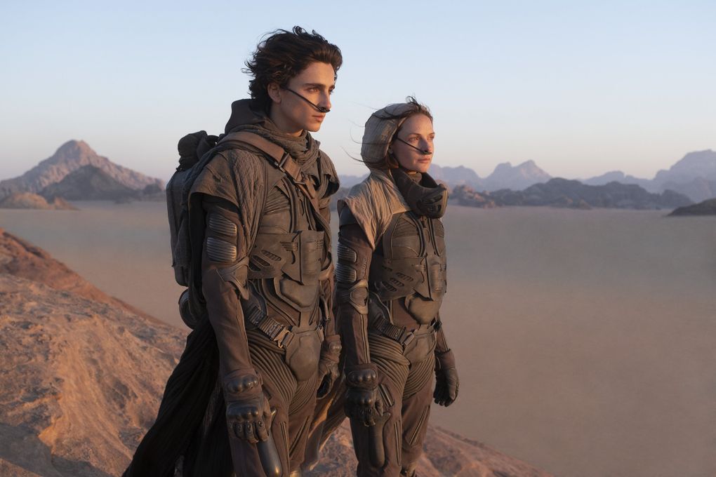 Timothée Chalamet, left, and Rebecca Ferguson in a scene from “Dune.” (Chiabella James / Warner Bros. Entertainment via The Associated Press)
