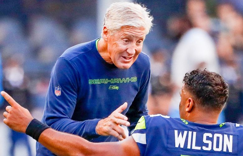 Lumen Field, Seattle, Wash. – Seattle Seahawks vs. Los Angeles Chargers preseason – 082821

Seattle Seahawks head coach Pete Carroll chats with quarterback Russell Wilson before the start of a game against the Los Angeles Chargers Saturday, Aug. 28, 2021, in Seattle. 218070 218070