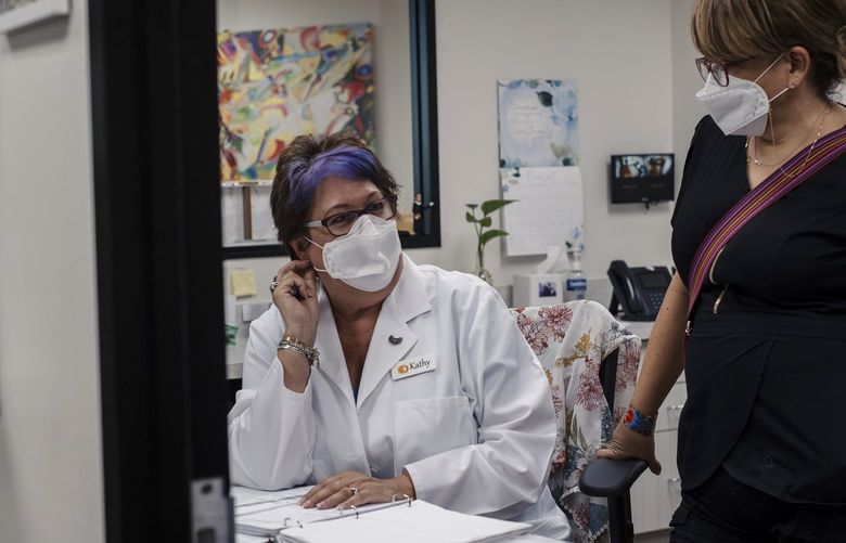 Kathy Kleinfeld, left, and nurse Catalina Leano. MUST CREDIT: Photo by May-Ying Lam for The Washington Post