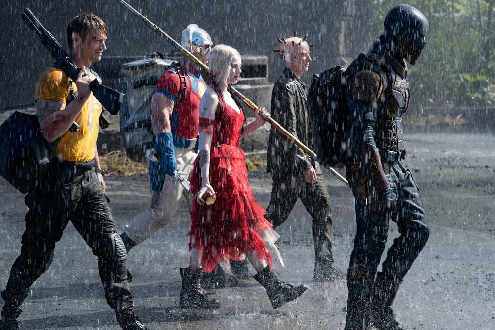 “The Suicide Squad” includes, from left, Joel Kinneman, John Cena, Margot Robbbie, Sean Gunn and Idris Elba. (Warner Bros.)