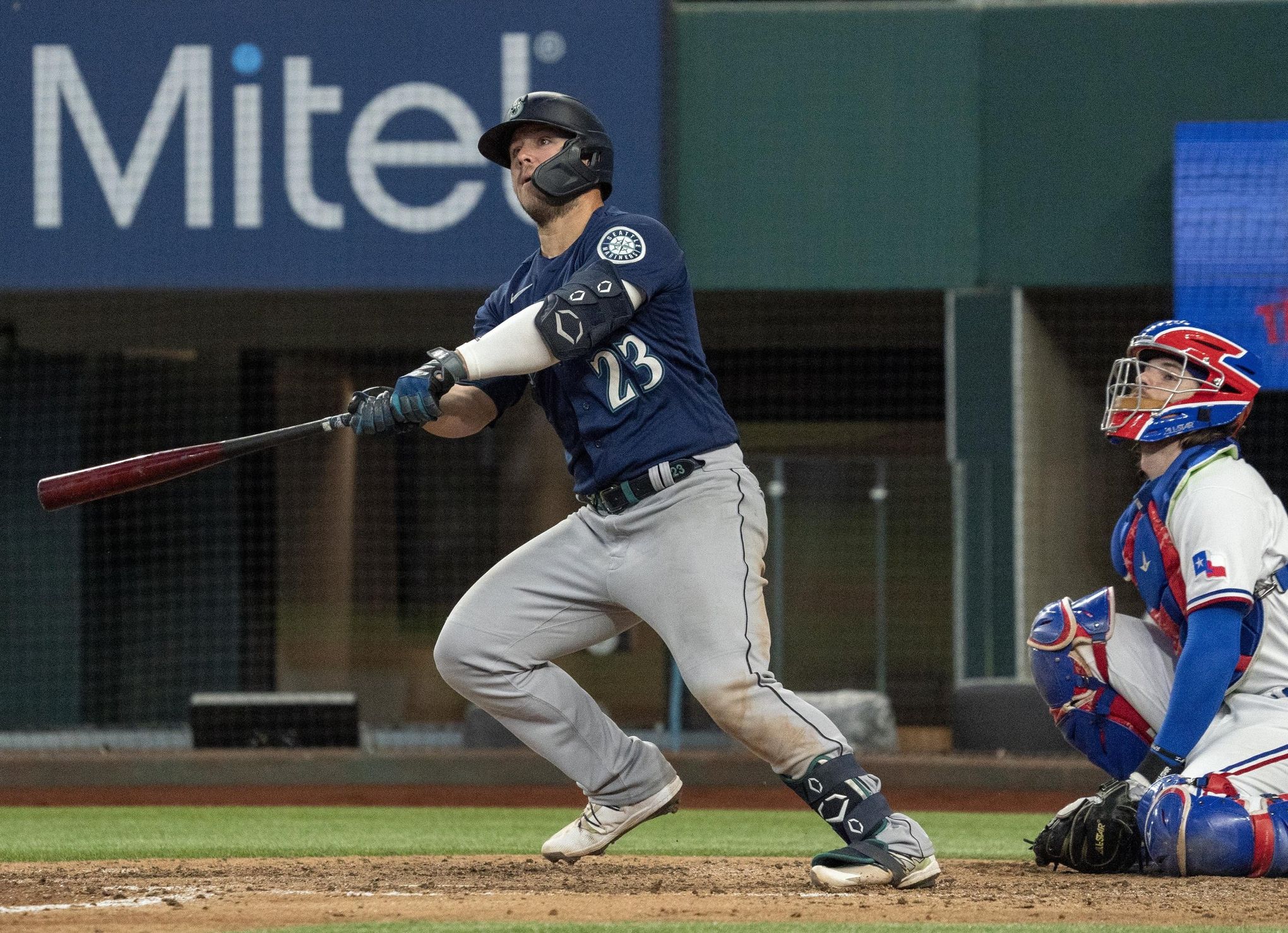 Seattle Mariners' Ty France watches the flight of his run-scoring