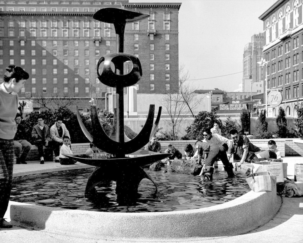 Tsutakawa family and friends install rocks around the base of George Tsutakawa’s “Fountain of Wisdom” at Seattle Public Library’s downtown Central Library in 1960. (Johsel Namkung)