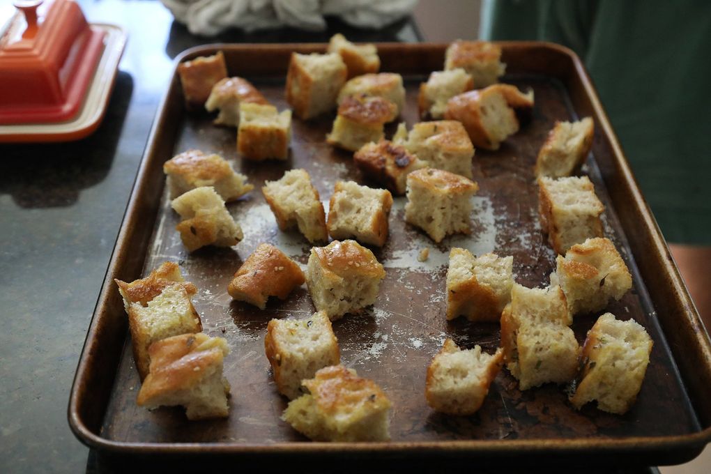 Brett Bankson, a Seattle-area neuroscience student is competing on the TV show “Top Chef Amateurs.” He sliced up these bread croutons for a salad, heated on a pan for a short time. (Greg Gilbert / The Seattle Times)