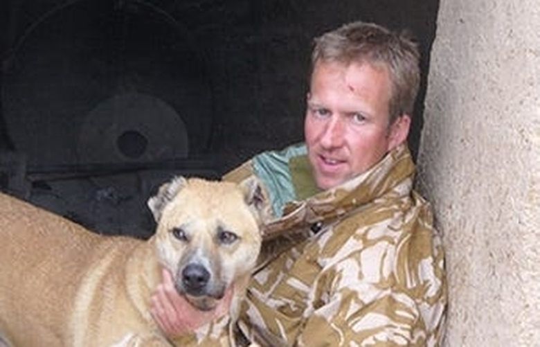 Sgt. Pen Farthing of the British Royal Marines is shown in this undated photo in Afghanistan with the dog he adopted, named Nowzad after the village where Farthing rescued him from a dogfight.  Paul “Pen” Farthing is the Nowzad animal shelter founder.