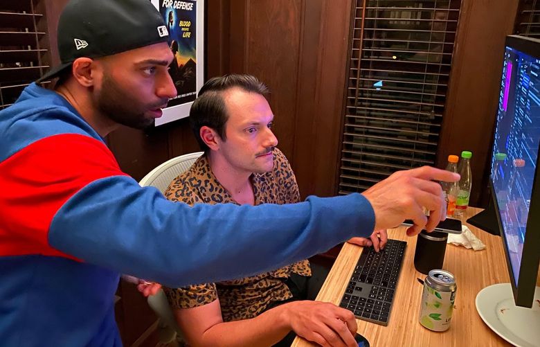 Jon Reed and Junaid Lughmani coordinate online with volunteers to help evacuees make it inside the Kabul airport from Berkeley, Calif. MUST CREDIT: Washington Post photo by Jonathan Baran