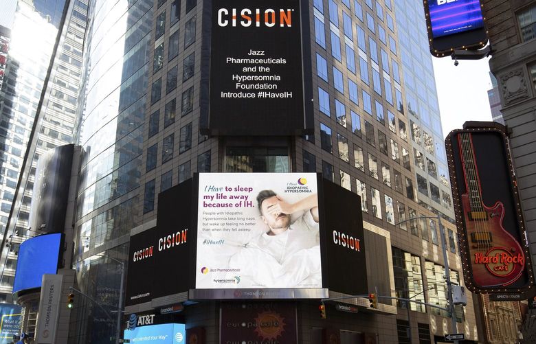 In an undated photo from Jazz Pharmaceuticals, an advertisement from the company and the Hypersomnia Foundation in Times Square. Jazz Pharmaceuticals brought in more than $1.7 billion last year selling GHB to narcolepsy patients. With the new approval, sales could soar. (Jazz Pharmaceuticals via The New York Times) — NO SALES; FOR EDITORIAL USE ONLY WITH NYT STORY SLEEP DISORDER GHB BY VIRGINIA HUGHES FOR AUG. 12, 2021. ALL OTHER USE PROHIBITED. —
