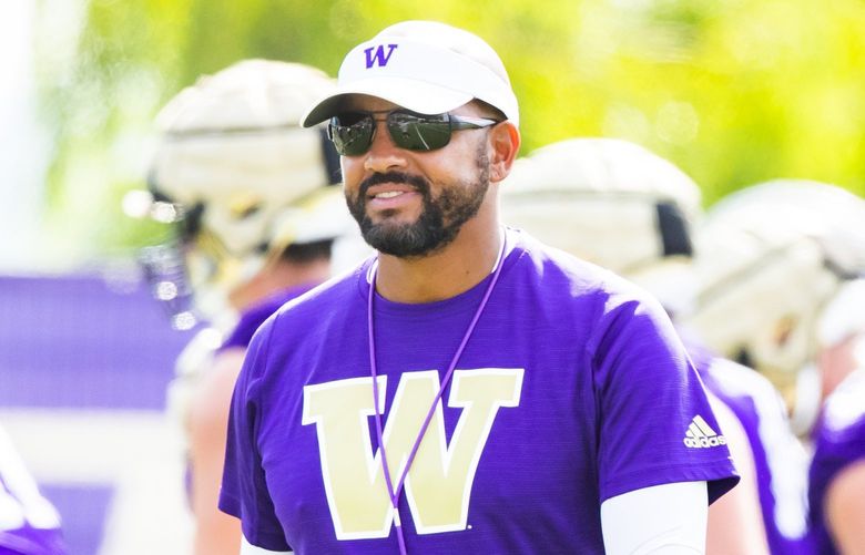 Head coach Jimmy Lake watches over practice during fall camp at the University of Washington’s Husky Stadium in Seattle Sunday August 15, 2021. 217937
