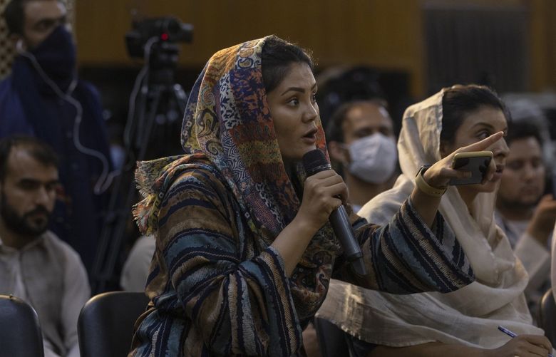 A female reporter asks a question during a Taliban news conference in Kabul, Afghanistan on Aug. 24, 2021. (Victor J. Blue/The New York Times) XNYT49 XNYT49